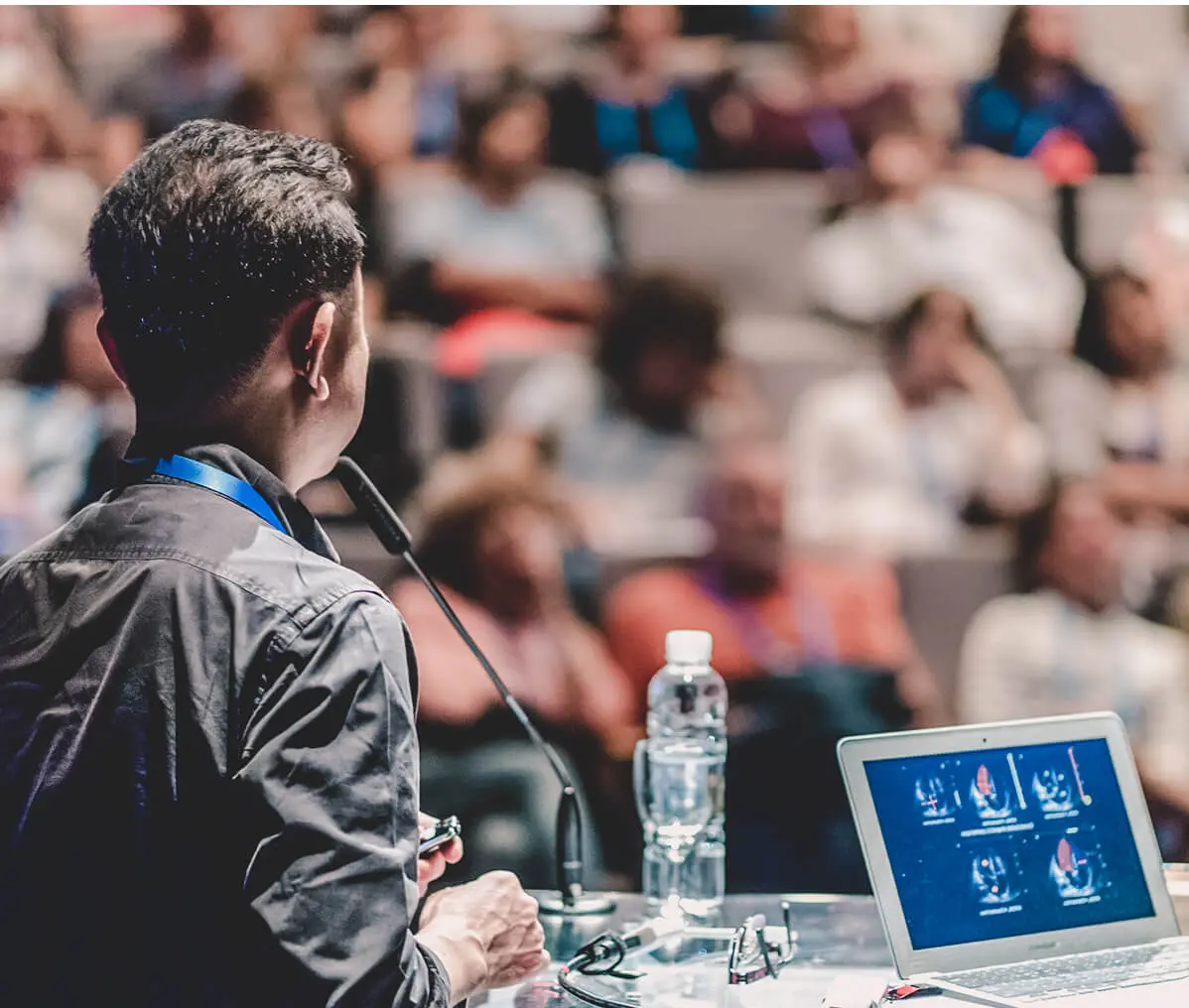 Speaker presenting at a conference