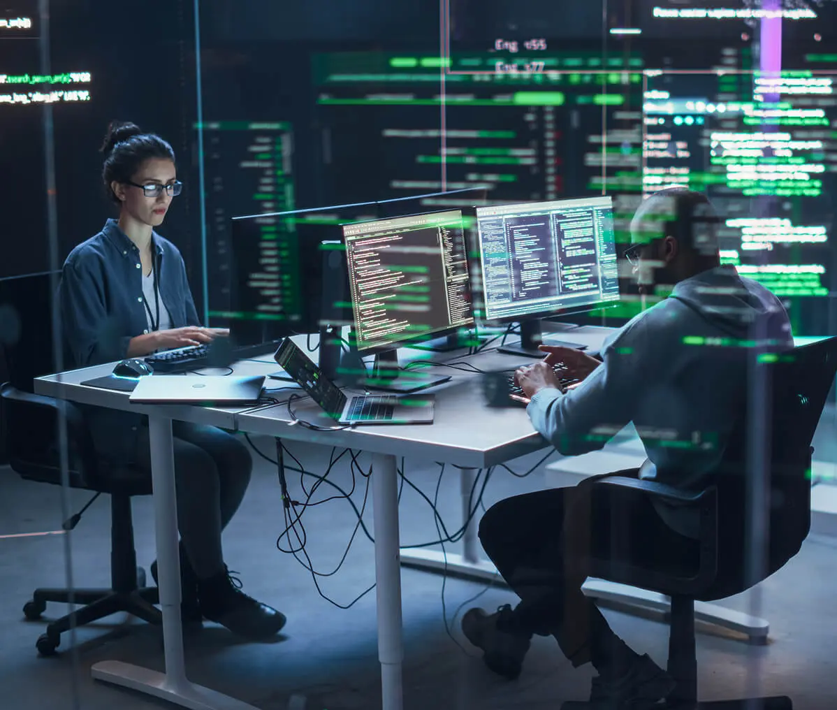 Software developers at computer workstations