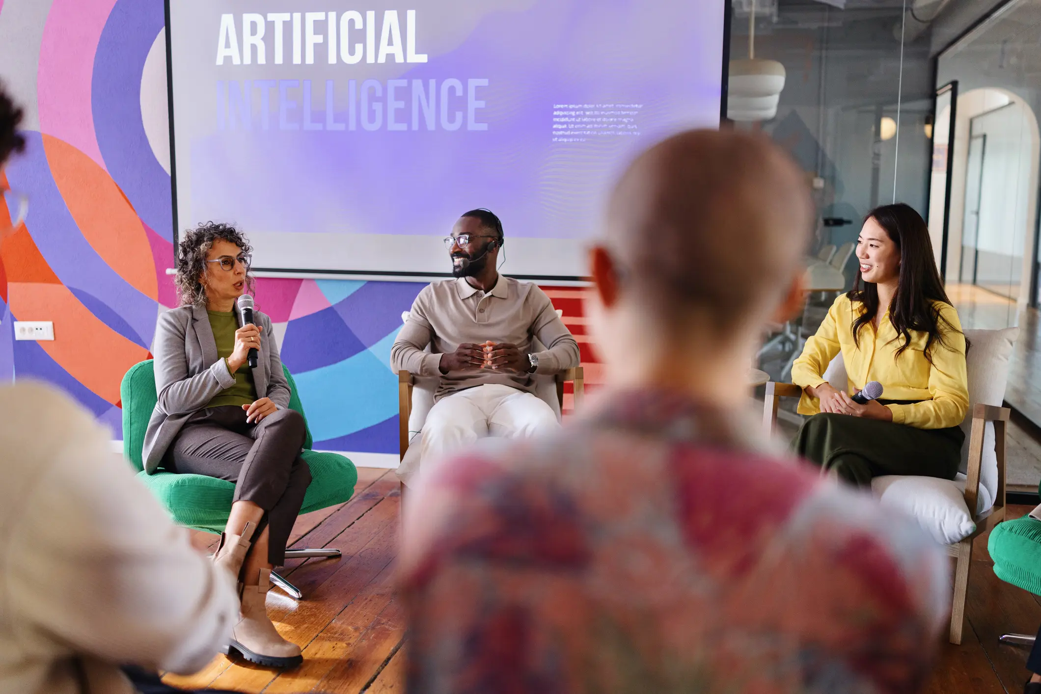 People engaged in a discussion on artificial intelligence in a casual setting.