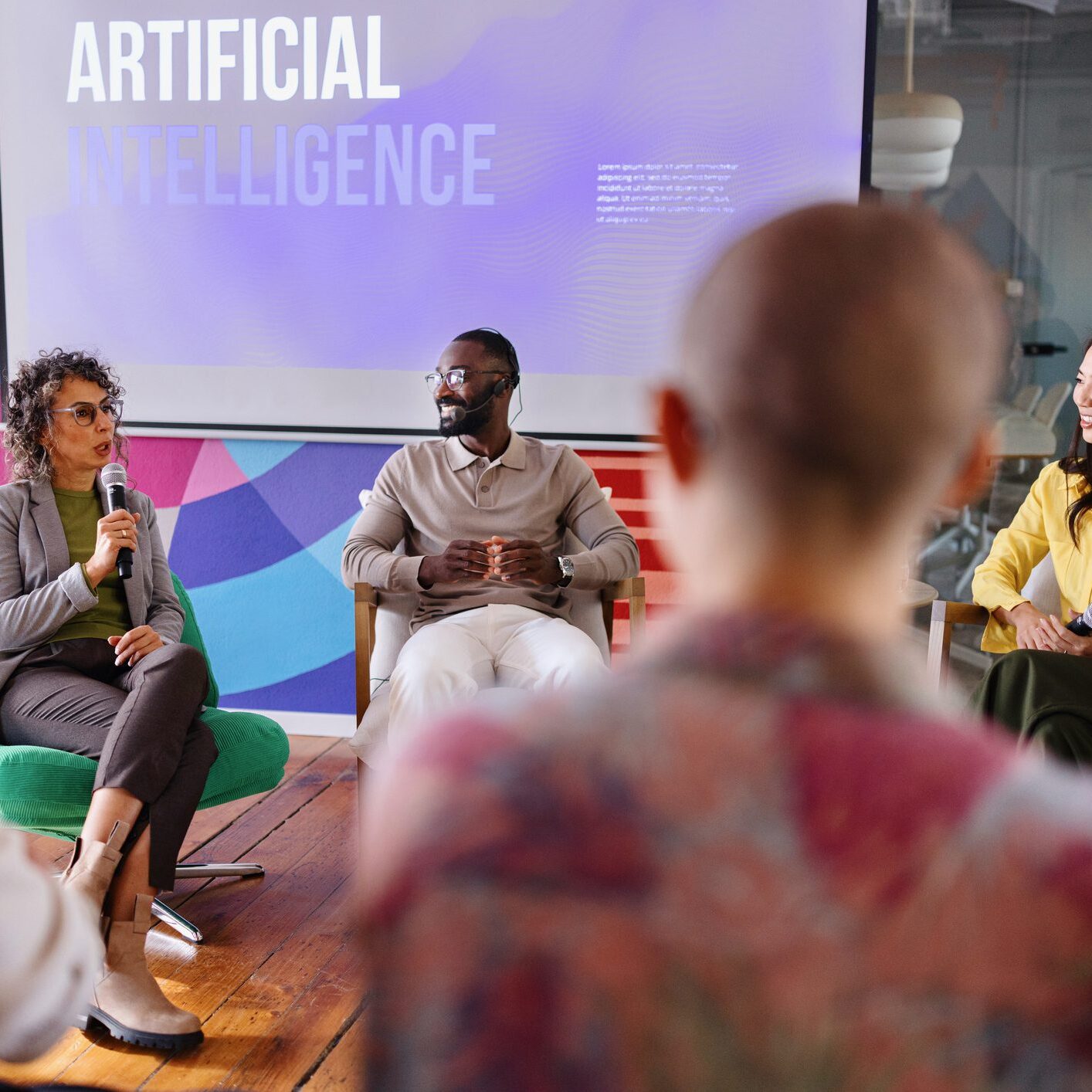 People engaged in a discussion on artificial intelligence in a casual setting.