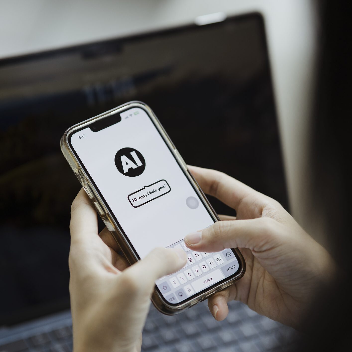 Person holding a smartphone with an AI app open on the screen.